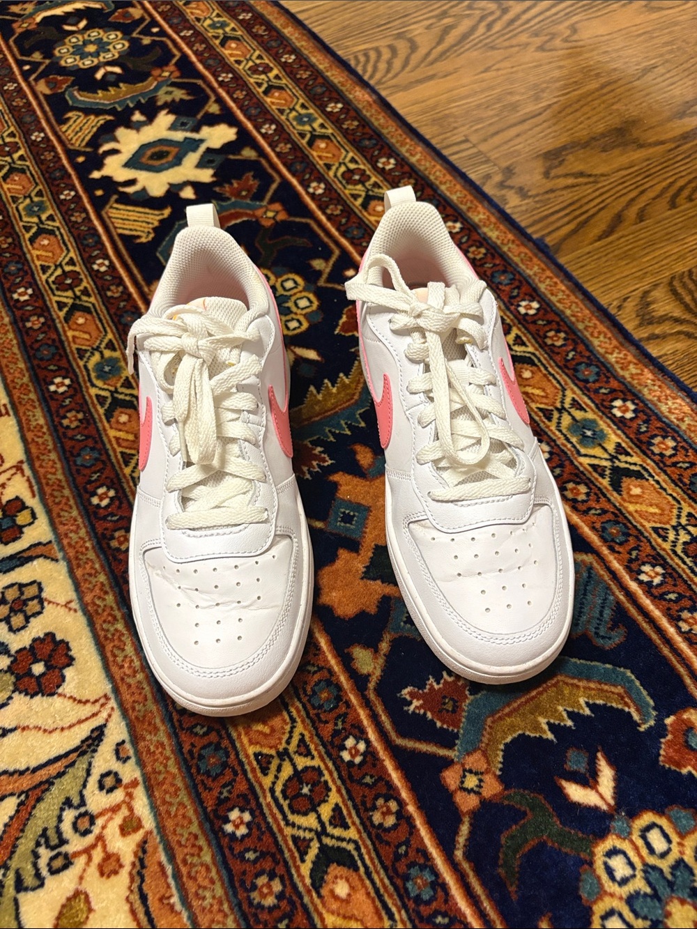 Nike Women's White Sneakers with Pink Swoosh